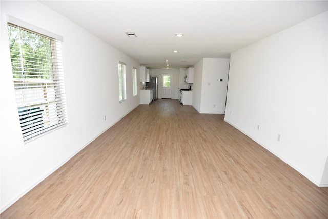 19591 Manduca Dr, New Caney, TX 77357 - empty room featuring light wood-style flooring and recessed lighting