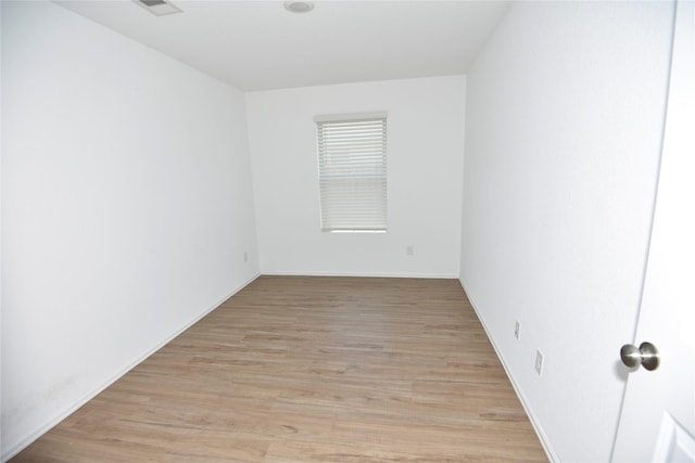 19591 Manduca Dr, New Caney, TX 77357 - unfurnished room featuring light wood-type flooring and baseboards