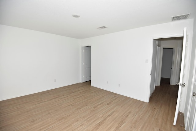 19591 Manduca Dr, New Caney, TX 77357 - unfurnished room featuring light wood-style flooring and baseboards