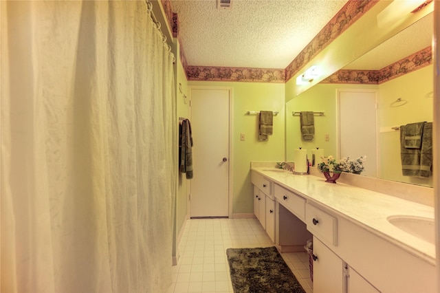 3819 Ridgeview Dr, Missouri City, TX 77459 - full bathroom featuring a textured ceiling, double vanity, and tile patterned floors