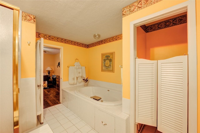 3819 Ridgeview Dr, Missouri City, TX 77459 - ensuite bathroom with a bath, tile patterned floors, and a textured ceiling