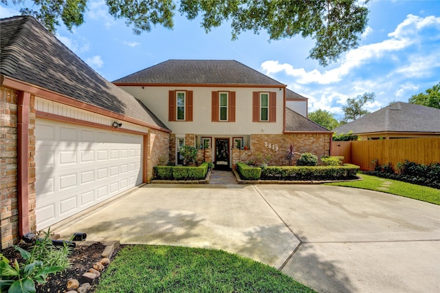 3819 Ridgeview Dr, Missouri City, TX 77459 - traditional-style house with brick siding, driveway, a garage, and roof with shingles