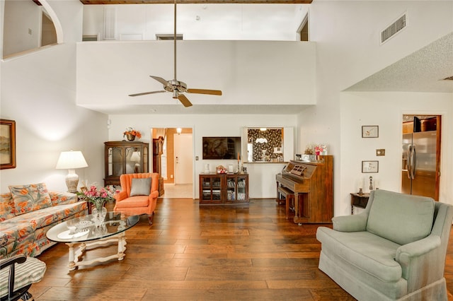 3819 Ridgeview Dr, Missouri City, TX 77459 - living room with a high ceiling, a ceiling fan, and hardwood / wood-style floors