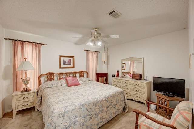 3819 Ridgeview Dr, Missouri City, TX 77459 - bedroom featuring light carpet, ceiling fan, and a textured ceiling