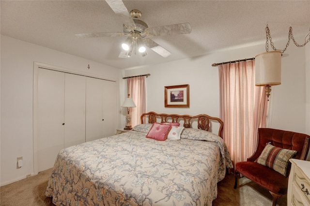 3819 Ridgeview Dr, Missouri City, TX 77459 - bedroom with carpet flooring, a closet, a ceiling fan, and a textured ceiling