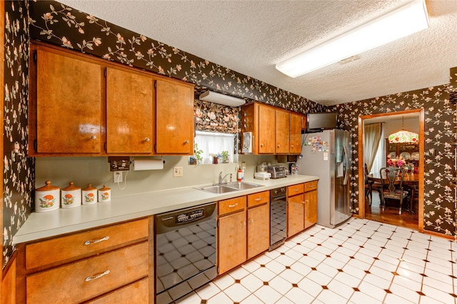 3819 Ridgeview Dr, Missouri City, TX 77459 - kitchen with dishwasher, stainless steel refrigerator with ice dispenser, wallpapered walls, a sink, and a textured ceiling
