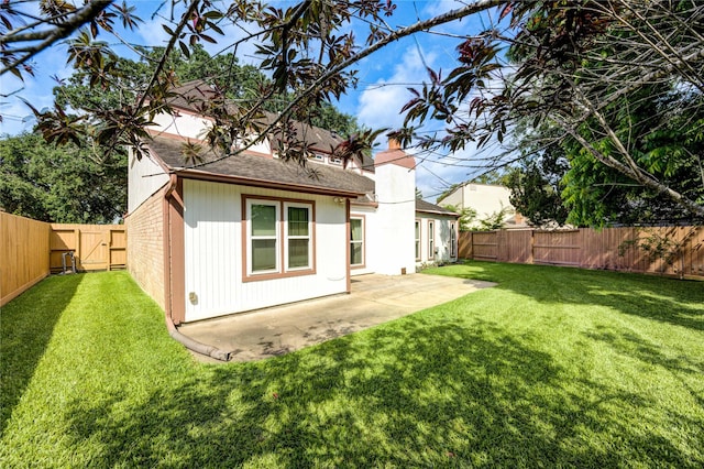 3819 Ridgeview Dr, Missouri City, TX 77459 - back of house featuring a shingled roof, a patio area, a chimney, and a gate