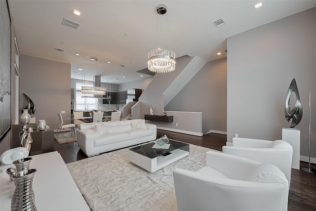 5919 E Post Oak Ln, Houston, TX 77055 - living room with a chandelier, wood finished floors, baseboards, and recessed lighting