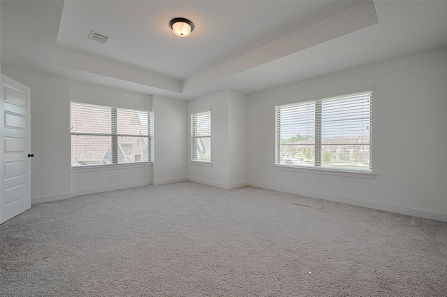 23604 Olive Creek Ln, New Caney, TX 77357 - carpeted empty room with a tray ceiling and baseboards