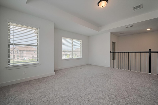 23604 Olive Creek Ln, New Caney, TX 77357 - carpeted spare room featuring baseboards and a raised ceiling