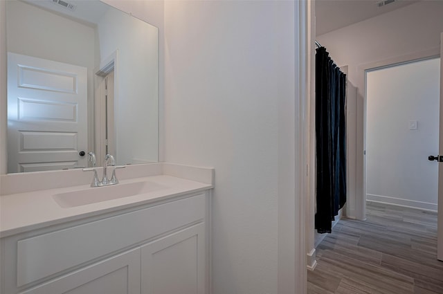 23604 Olive Creek Ln, New Caney, TX 77357 - full bath featuring vanity, baseboards, curtained shower, and wood finished floors