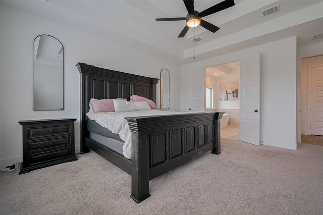 23604 Olive Creek Ln, New Caney, TX 77357 - carpeted bedroom featuring baseboards, connected bathroom, and ceiling fan