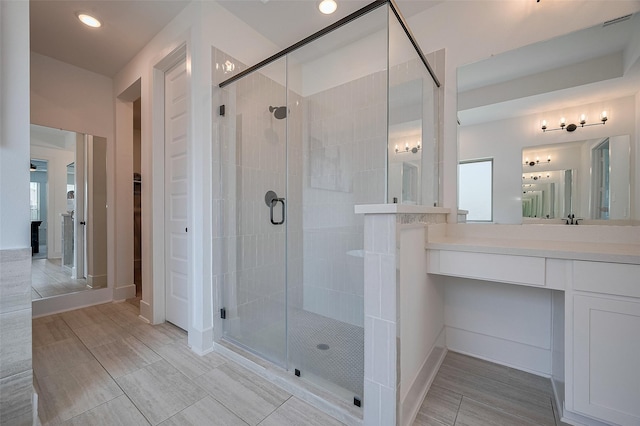 23604 Olive Creek Ln, New Caney, TX 77357 - full bath with a stall shower, recessed lighting, vanity, baseboards, and a closet