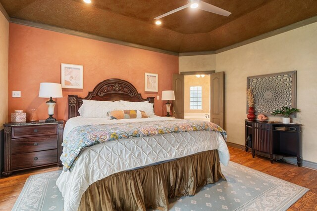 60 Fairfield Dr, Montgomery, TX 77356 - bedroom with wood finished floors, baseboards, and a ceiling fan