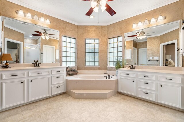 60 Fairfield Dr, Montgomery, TX 77356 - full bath featuring a ceiling fan, ornamental molding, two vanities, a shower stall, and a bath