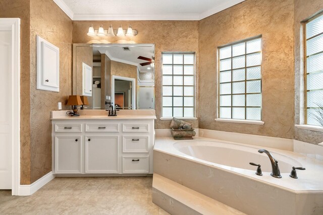 60 Fairfield Dr, Montgomery, TX 77356 - full bathroom with plenty of natural light, ornamental molding, a bath, vanity, and a textured wall