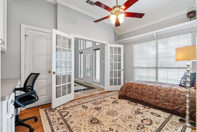 60 Fairfield Dr, Montgomery, TX 77356 - bedroom with crown molding, french doors, wood finished floors, vaulted ceiling, and a ceiling fan