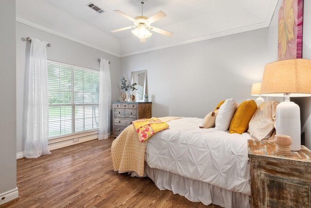 60 Fairfield Dr, Montgomery, TX 77356 - bedroom with wood finished floors, ornamental molding, baseboards, and ceiling fan