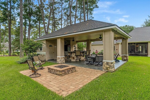 60 Fairfield Dr, Montgomery, TX 77356 - view of patio with a ceiling fan and a fire pit