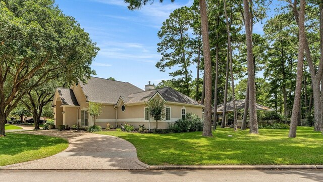 60 Fairfield Dr, Montgomery, TX 77356 - view of front of house with stucco siding, a gazebo, a front lawn, and curved driveway