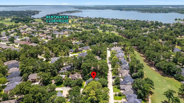 60 Fairfield Dr, Montgomery, TX 77356 - aerial overview of property's location with nearby suburban area, a nearby body of water, and a local golf course