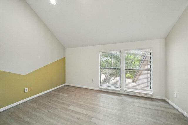 4144 Greystone Way Unit 305, Sugar Land, TX 77479 - unfurnished room featuring wood finished floors, lofted ceiling, and baseboards