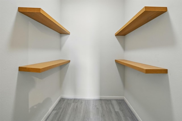 4144 Greystone Way Unit 305, Sugar Land, TX 77479 - walk in closet featuring wood finished floors