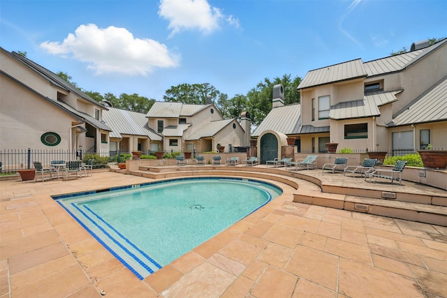 4144 Greystone Way Unit 305, Sugar Land, TX 77479 - community pool with a patio area, fence, and a residential view