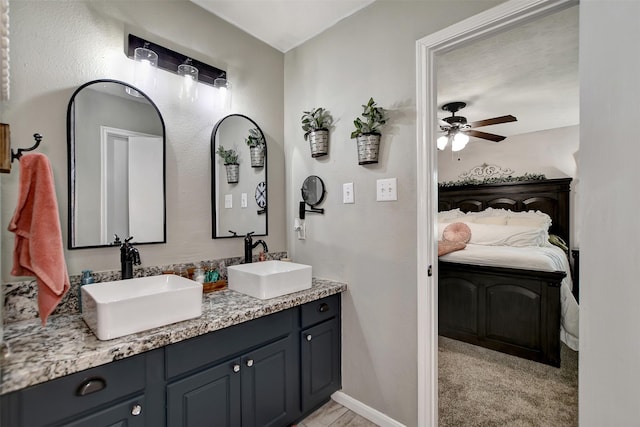 25401 Hunting Trl, Magnolia, TX 77355 - bathroom featuring connected bathroom, a ceiling fan, and double vanity