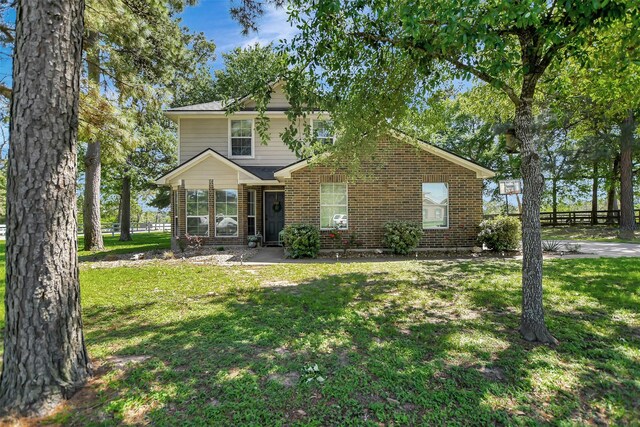 25401 Hunting Trl, Magnolia, TX 77355 - view of front facade with brick siding