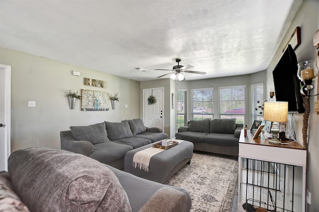 25401 Hunting Trl, Magnolia, TX 77355 - living room with ceiling fan and a textured ceiling