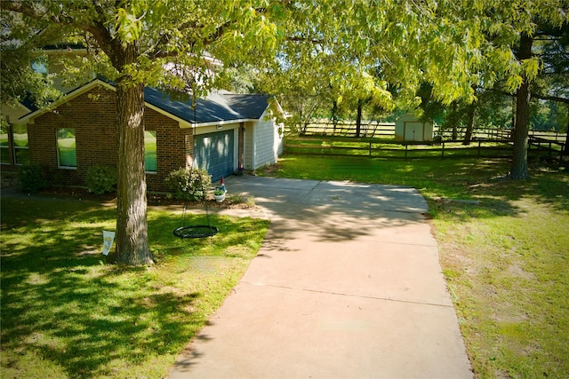 25401 Hunting Trl, Magnolia, TX 77355 - view of home's exterior featuring brick siding, a shed, and an outbuilding