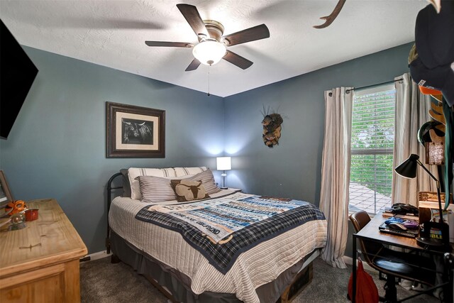 25401 Hunting Trl, Magnolia, TX 77355 - bedroom with dark carpet, a ceiling fan, and a desk