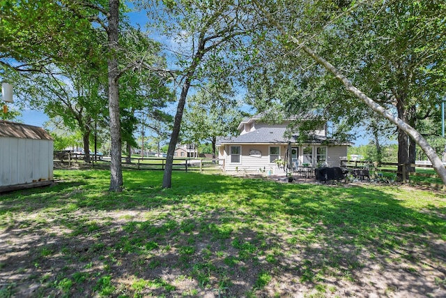 25401 Hunting Trl, Magnolia, TX 77355 - view of yard with a storage shed, an outdoor structure, and a patio