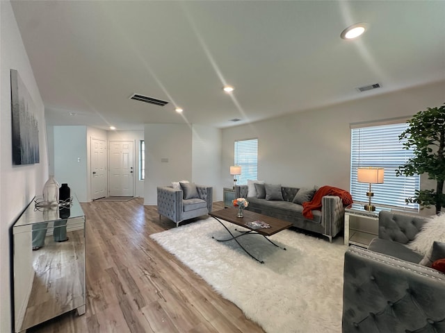 11079 N Lake Mist Ln, Willis, TX 77318 - living room with plenty of natural light, light wood-style floors, recessed lighting, and baseboards