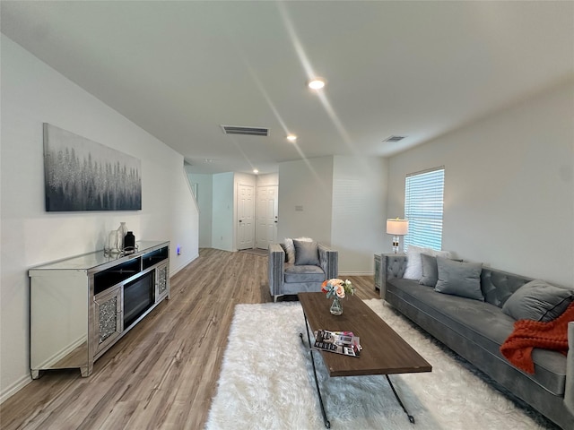 11079 N Lake Mist Ln, Willis, TX 77318 - living room with light wood-style floors, baseboards, and recessed lighting