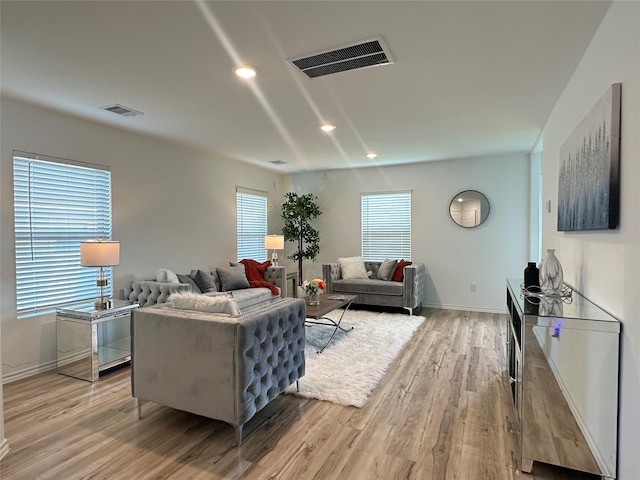 11079 N Lake Mist Ln, Willis, TX 77318 - living room with light wood-type flooring, baseboards, and recessed lighting
