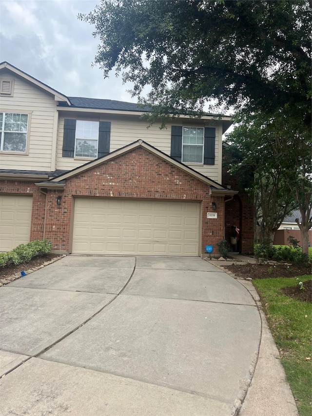 5339 Canyon Hollow Dr, Houston, TX 77084 - traditional-style home with brick siding, driveway, and a garage