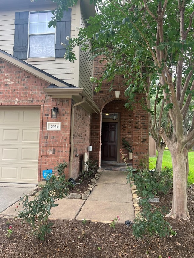 5339 Canyon Hollow Dr, Houston, TX 77084 - doorway to property with brick siding and a garage
