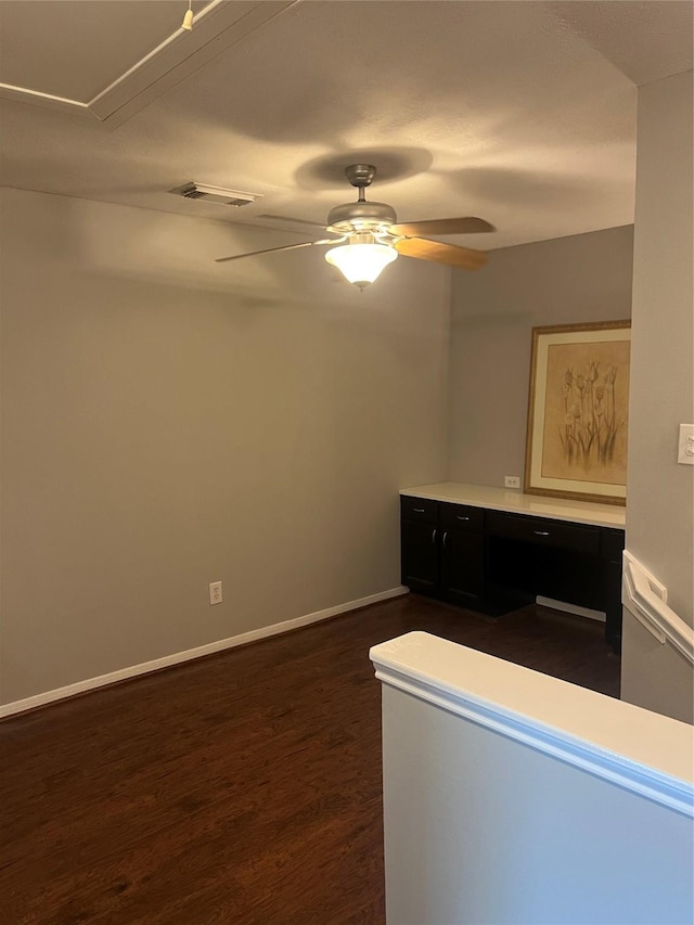 5339 Canyon Hollow Dr, Houston, TX 77084 - unfurnished room featuring dark wood-style floors, a ceiling fan, baseboards, and attic access