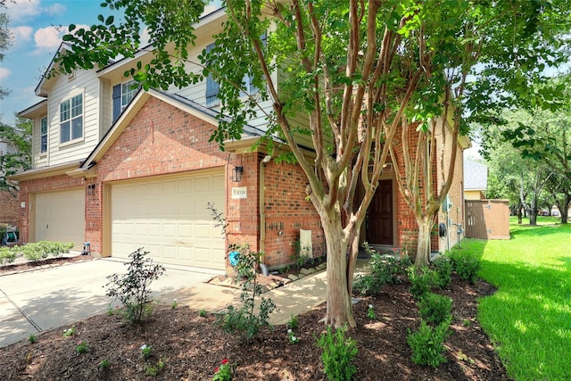5339 Canyon Hollow Dr, Houston, TX 77084 - view of front of home with brick siding, a front yard, and driveway