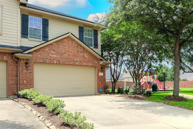 5339 Canyon Hollow Dr, Houston, TX 77084 - view of side of property featuring brick siding, driveway, and an attached garage