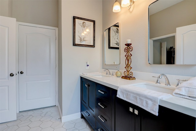 5339 Canyon Hollow Dr, Houston, TX 77084 - bathroom featuring double vanity, tile patterned flooring, and baseboards