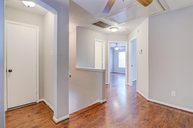 5339 Canyon Hollow Dr, Houston, TX 77084 - hall featuring attic access, an upstairs landing, wood finished floors, and baseboards
