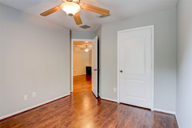 5339 Canyon Hollow Dr, Houston, TX 77084 - unfurnished bedroom featuring wood finished floors, baseboards, and ceiling fan
