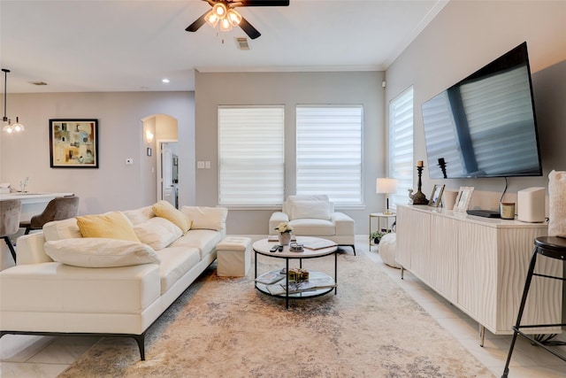 5339 Canyon Hollow Dr, Houston, TX 77084 - living room featuring ceiling fan, arched walkways, light tile patterned floors, recessed lighting, and ornamental molding