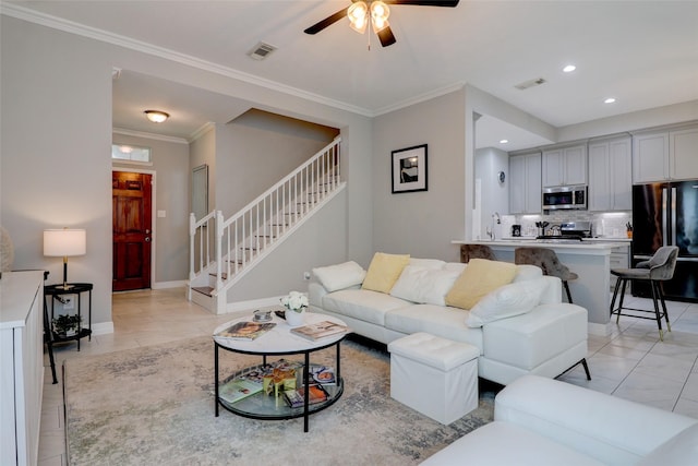 5339 Canyon Hollow Dr, Houston, TX 77084 - living area with stairway, a ceiling fan, light tile patterned floors, recessed lighting, and ornamental molding