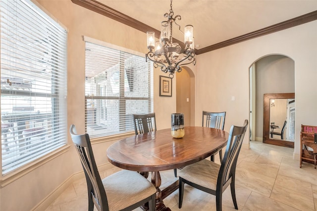 40610 Ithaca Ln, Magnolia, TX 77354 - dining area featuring arched walkways, crown molding, healthy amount of natural light, a chandelier, and baseboards