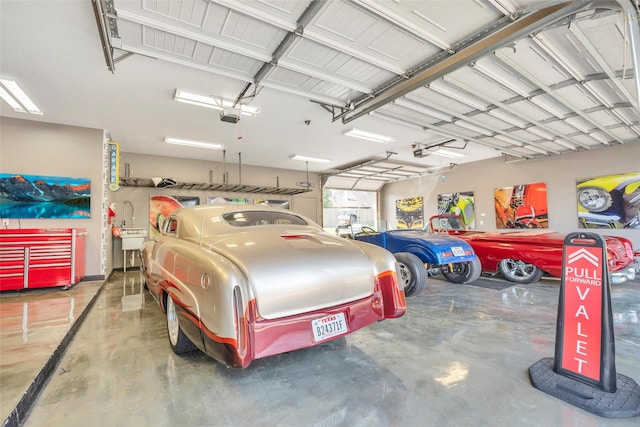 40610 Ithaca Ln, Magnolia, TX 77354 - garage featuring a garage door opener