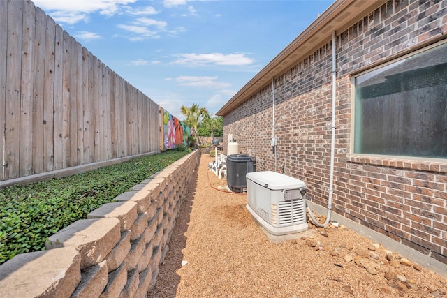 40610 Ithaca Ln, Magnolia, TX 77354 - view of home's exterior featuring brick siding and fence